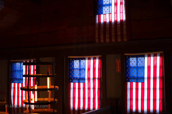 Flags adorn the windows inside Vine Brook Tavern.